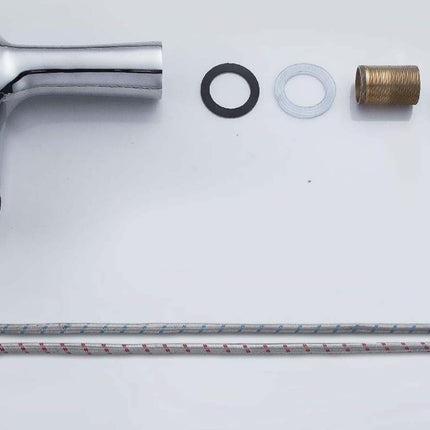 A chrome bathroom faucet handle set with mounting hardware, including a brass threaded fitting, washers, gaskets, and two braided supply lines, arranged on a plain white background.