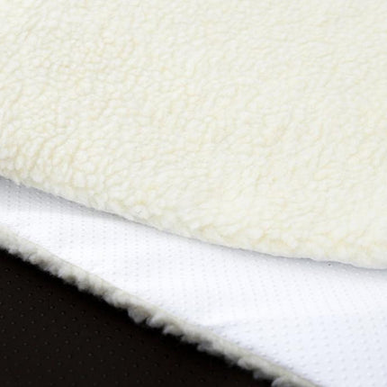 Close-up of white fleece fabric with a black background