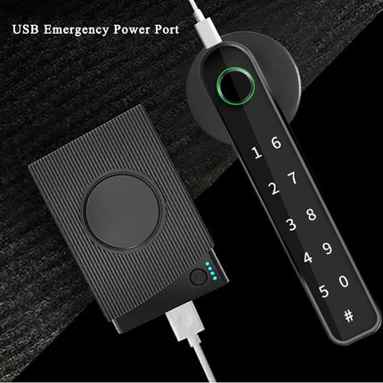 Black electronic device with keypad and USB emergency power port on a dark textured background
