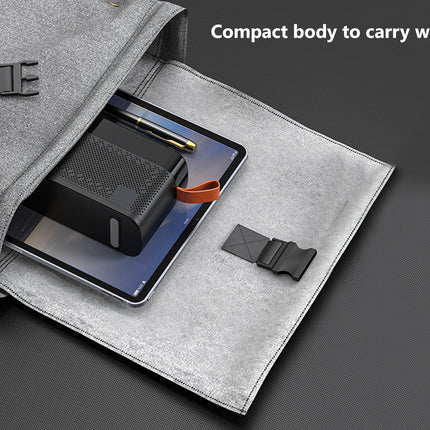A gray fabric tablet sleeve or pouch shown open on a dark gray background, with a tablet and a black rectangular accessory inside. White text in the top right reads, 'Compact body to carry with you.