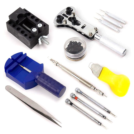 Collection of various tools including a blue tool, black clamp, and yellow bulb on a white background.
