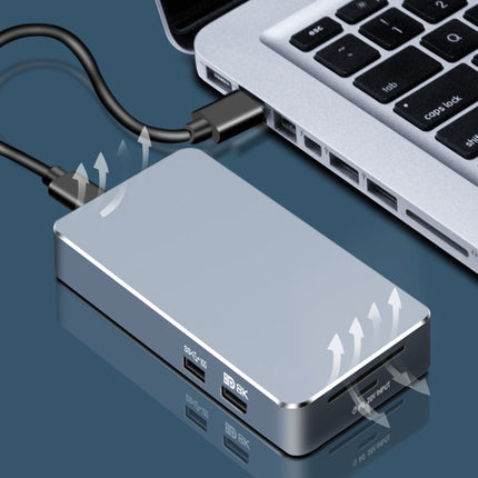 USB-C hub connected to a laptop on a reflective surface