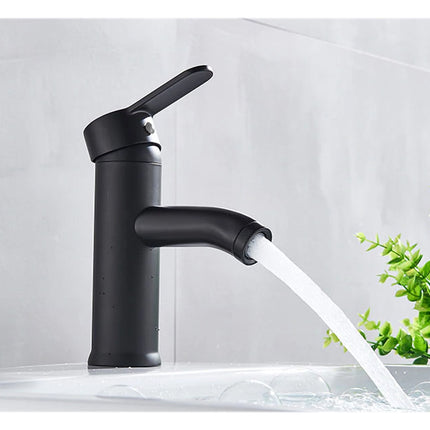 Black faucet with water flowing into a sink against a light gray background