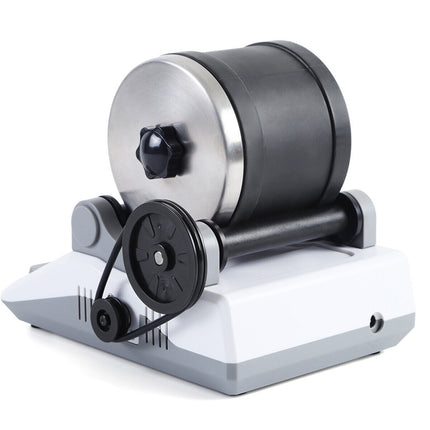 Small mechanical device with a cylindrical component on a white background