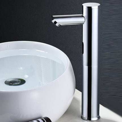A modern chrome single-handle bathroom faucet shown next to a white round vessel sink against a dark textured background.