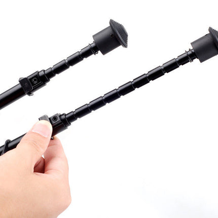 Two black extendable sticks held by a hand on a white background