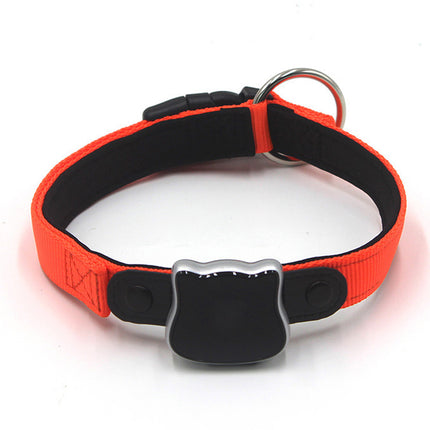 Red and black dog collar with a reflective patch on a white background