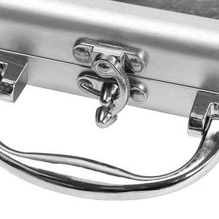 Close-up of a metal handle with a latch on a metallic surface
