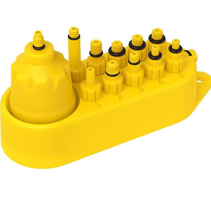 Yellow plastic fitting block with multiple nozzles on a white background