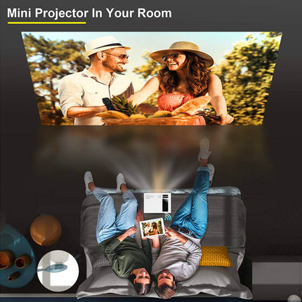 Mini projector in use with a couple outdoors and on a couch.