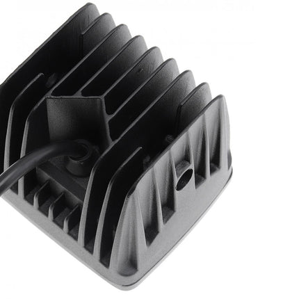 Black electronic component with a cable on a white background