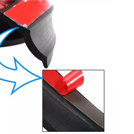 Close-up of a red and black car bumper with a blue arrow pointing to a small red component.