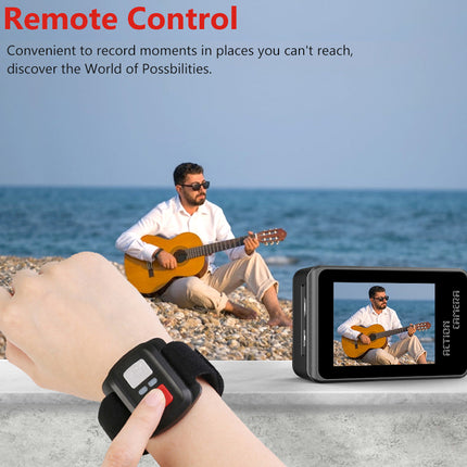 Person playing guitar on a beach with a camera and remote control device displayed.