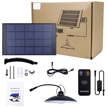 Solar light kit with solar panel, lamp, controller, and packaging on a white background