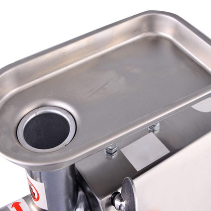 Metallic meat grinder with a clear plastic cover on a white background