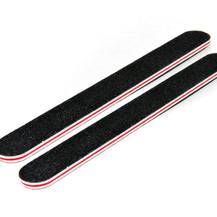 Two black sanding blocks with red edges on a white background
