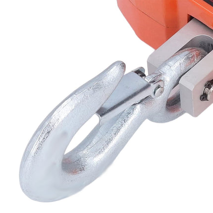 Close-up of a metal hook attached to an orange mechanical device on a white background