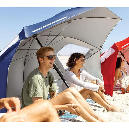 People sitting under beach umbrellas on a sunny day