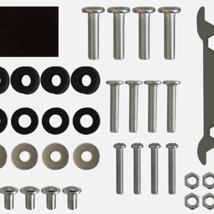 Collection of screws, washers, and a wrench on a white background