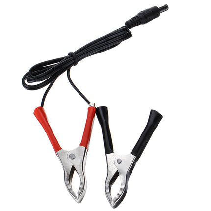 Pair of alligator clips with red and black handles on a white background