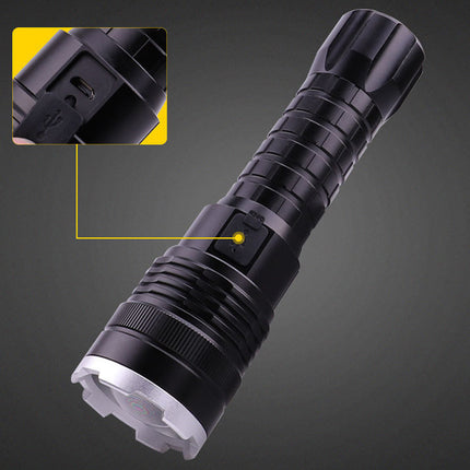 Black flashlight with detailed view of switch on a dark background