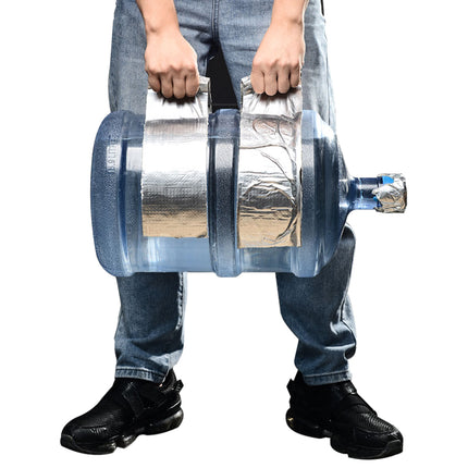 Person holding a large insulated water bottle with reflective silver wrap on a white background