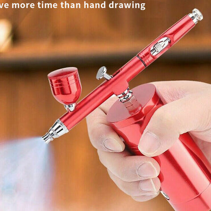 A red portable airbrush pen held in a hand, with a small spray mist visible at the tip and a blurred wooden background. White text at the top reads, 'Save more time than hand drawing.