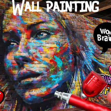A colorful graffiti-style mural of a woman's face painted on a brick wall, with large white text reading 'WALL PAINTING' at the top, a black speech bubble saying 'Wow! Brains!', a red heart-shaped object in the lower right, and a small cartoon cherry graphic on the left.