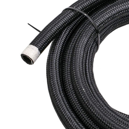 Coiled black braided hose with a white fitting on a white background