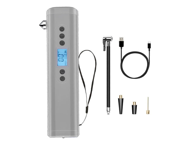 A handheld electronic device with a gray body, digital display, and wrist strap, shown alongside several accessories including a pen-like tool, USB cable, and small metal tips on a plain white background.