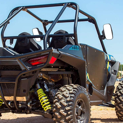 Side view of an off-road vehicle with a clear sky background