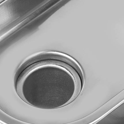 Close-up of a stainless steel kitchen sink drain