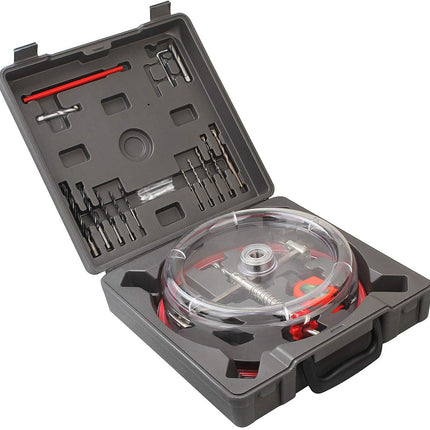 Tool kit with various tools and components in a gray case on a white background