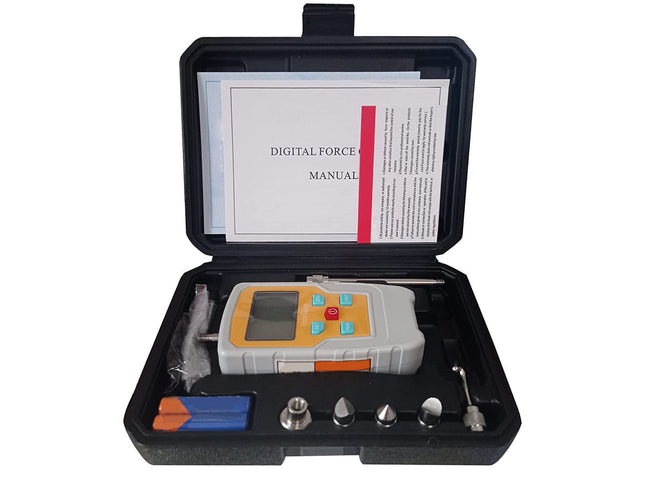 Digital force gauge in a black case with a manual on a white background