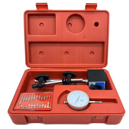 Open red tool case with mechanical measurement tools on a white background