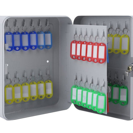 Key cabinet with multiple key holders and color-coded tags on a white background