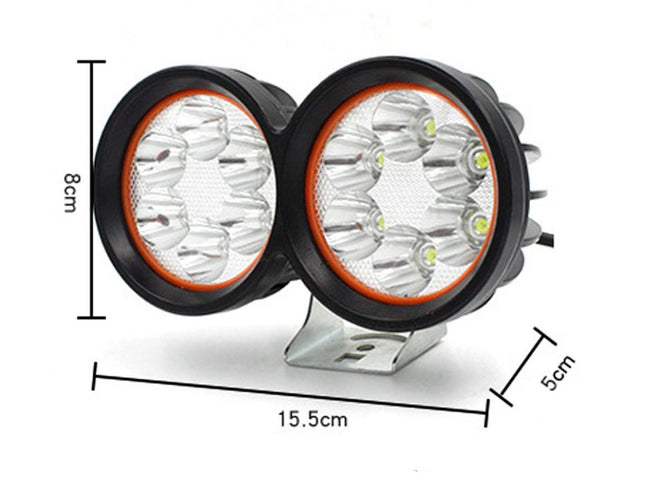 Pair of round LED lights with measurements on a white background