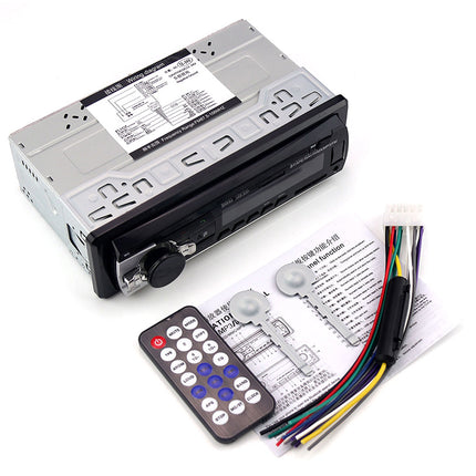 Car stereo system with remote control and wiring harness on a white background