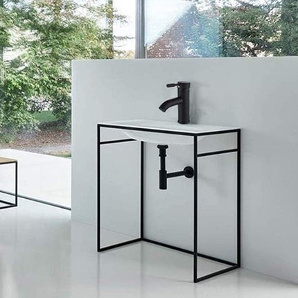 Modern bathroom vanity with black fixtures against a white wall.