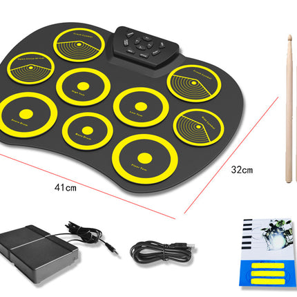 Electronic drum pad with drumsticks, power adapter, and cable on a white background