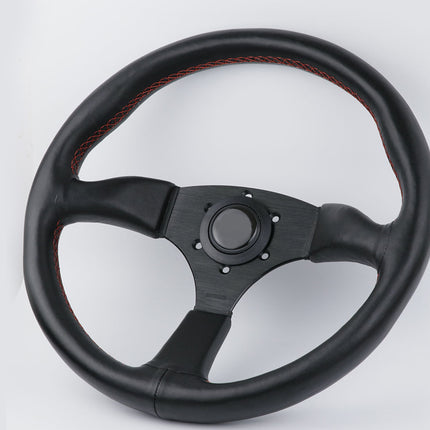 Black steering wheel with red stitching on a white background