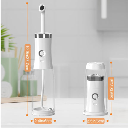A white and silver oral irrigator shown next to its smaller charging base, with orange dimension callouts indicating height and width measurements on a light kitchen counter.