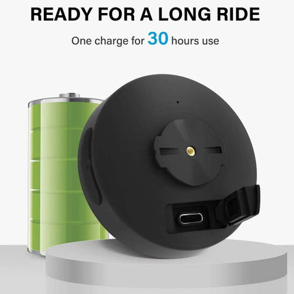 Black round device with green cylindrical battery on a white background, featuring text about battery life.
