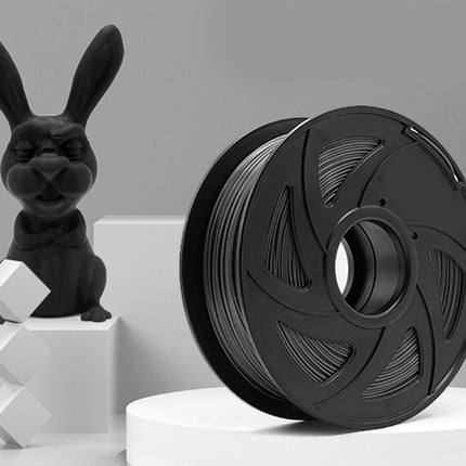 Black 3D printing filament spool with a small rabbit-shaped object on a gray background