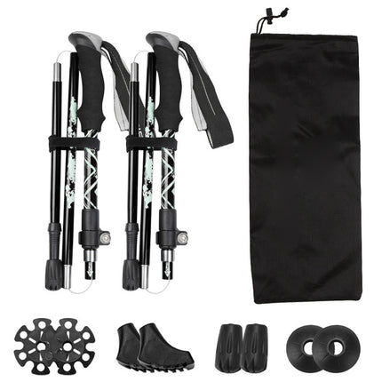 Set of black hiking poles with accessories on a white background