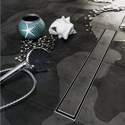 Shower head and accessories on a dark tiled floor