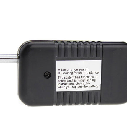 Black electronic device with a label on a white background