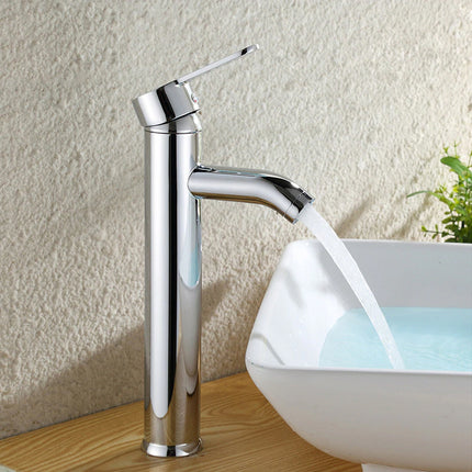Chrome faucet with water flowing into a white sink against a textured wall.