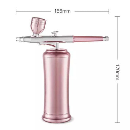 A metallic pink and silver airbrush gun with a matching pink cup, shown on a white background with dimension lines indicating 155mm width and 170mm height.