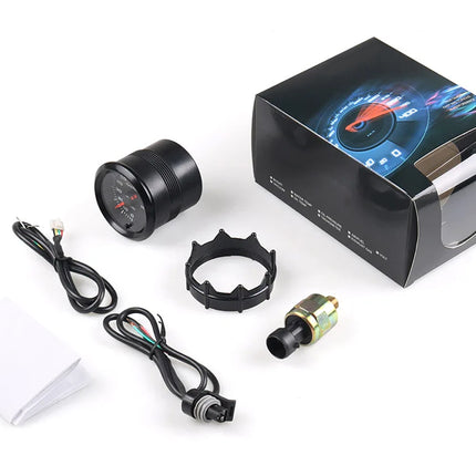 Car dashboard accessories including a gauge, connectors, and a box on a white background